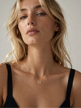 GIVENCHY Gold Pendant with Rhinestones.